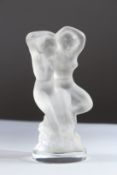 A FROSTED LALIQUE GROUP OF TWO NUDES on a circular base. Engraved Lalique, France. 14cms high.