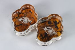 A PAIR OF PLATE AND FAUX TORTOISESHELL WINE COASTERS.