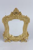 A GILT BRONZE EASEL MIRROR. 12ins high.
