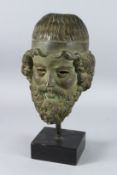 A MID 19TH CENTURY BRONZE GREEK BUST OF A MAN. 8ins, on a wooden base.