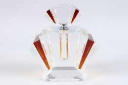 A LARGE ART DECO DESIGN AMBER COLOUR SCENT BOTTLE. 9ins high.