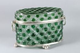 A LARGE SILVER PLATED AND GLASS OVAL CASKET with ring handles, on ball feet.