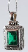 AN 18CT WHITE GOLD, EMERALD AND DIAMOND PENDANT.