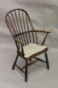 A COUNTRY MADE WINDSOR SPINDLE BACK ARMCHAIR.