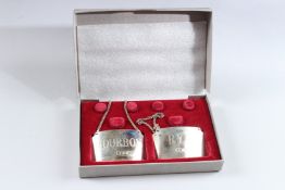 A PAIR OF SILVER CONCORDE BOXED BOTTLE LABELS. BOURBON AND RYE.