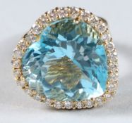 A SUPERB 18CT GOLD HEART SHAPED TOPAZ RING.