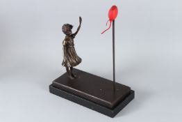 AFTER BANKSY. A young girl with a red heart. 32cms high, on a marble base.