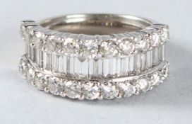 AN 18CT WHITE GOLD DIAMOND RING with baguette and round stones.