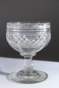 A LARGE REGENCY GLASS PEDESTAL BOWL, hobnail cut engraved with thistles, Circa. 1825. 7ins high.