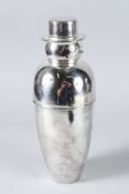 A SILVER PLATED SNOWMAN COCKTAIL SHAKER.