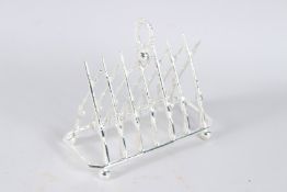 A PLATED RIFLE TOAST RACK.
