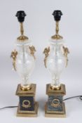 A GOOD PAIR OF REGENCY DESIGN CUT GLASS AND METAL LAMPS. 19ins high.