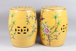 A PAIR OF CHINESE YELLOW PORCELAIN BARREL SEATS.
