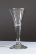 AN 18TH CENTURY WINE GLASS with tapering bowl. 17cms high.