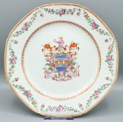 A GOOD CHINESE EXPORT PORCELAIN ARMORIAL PLATE, octagonal shape, the border with a garland of