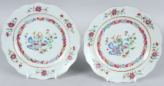 A SUPERB PAIR OF CHINESE FAMILLE ROSE PLATES. 9ins diameter. Painted with a European holding a bird.
