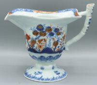 A GOOD CHINESE EXPORT PORCELAIN MILK JUG. 4.5ins high. Imari pattern, underglazed in red and gilt.