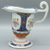 A GOOD CHINESE EXPORT PORCELAIN MILK JUG, CIRCA 1785. 4ins high. Painted with three panels of