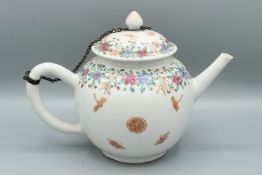 A CHINESE GLOBULAR TEAPOT AND COVER. The sides with dragons, flowers and butterflies and the lid