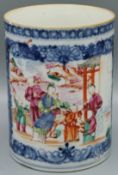 A CHINESE TANKARD with a panel of figures in a blue and white frame. Circa 1740.