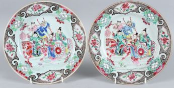 A PAIR OF CHINESE FAMILLE ROSE CIRCULAR PLATES. The centre with Chinese figures, horse, figures