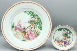 A SUPERB CHINESE EXPORT PORCELAIN PLATE decorated with figures cherry picking and a smaller