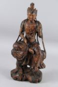 A SMALL CHINESE CARVED WOOD AND GILDED FIGURE OF GUANYIN sitting in a posture known as 
