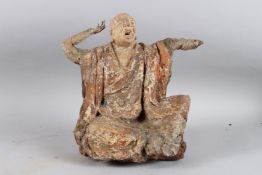 A CARVED WOOD AND POLYCHROME STATUE OF A SEATED MONK OF ARHAT, sitting cross legged, both arms