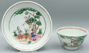 A GOOD CHINESE TEA BOWL AND SAUCER. Figures picking fruit. Circa 1740.