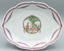 A CHINESE OVAL DISH. 6ins diameter. Figures in the Famille Rose palette. Circa 1740