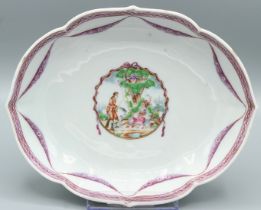 A CHINESE OVAL DISH. 6ins diameter. Figures in the Famille Rose palette. Circa 1740