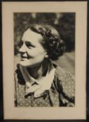 EARLY TO MID 20TH CENTURY PHOTOGRAPH of a smiling young woman large format, unframed, 58 x 37cm