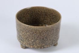 A CHINESE CRACKLE GLAZED TRIPOD BURNER. 11cms diameter.