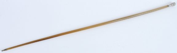 A 19TH CENTURY CHINESE SILVER TOPPED, possibly rhino horn, SWAGGER STICK. 76cms long. 95grams.