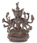 A CHINESE MULTI-ARM BRONZE DEITY. 23cms high.
