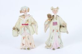 A LARGER PAIR OF BISQUE NODDERS. 16cms high.