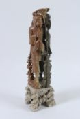 A CHINESE CARVED SOAPSTONE FIGURE OF A FISHERMAN. 40cms high.