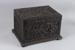 A GOOD 19TH CENTURY CARVED CHINESE TEA BOX with lead liner. 32cms long.