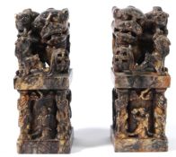 A PAIR OF CHINESE SOAPSTONE FOO DOG SEALS. 20cms high.