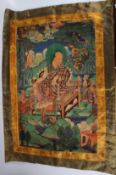 A TIBETAN THANGKA ON SILK.
