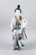 A LARGE JAPANESE PORCELAIN GEISHA. 44cms high.