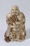 A JAPANESE STATUE OF HOTEI, also known as The Laughing Buddha, with character mark verso, holding a