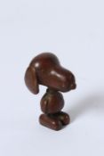 A JAPANESE BRONZE OKIMONO SNOOPY DOG. 4.5cms.