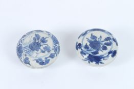 TWO HATCHER CARGO BLUE AND WHITE POTS AND COVERS, decorated with flowers. 9cms diameter.