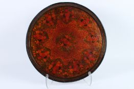 A VERY FINE AND LARGE 19TH CENTURY INDIAN KASHMIRI PAINTED AND LACQUERED PAPIER MACHE CHARGER. 42cms