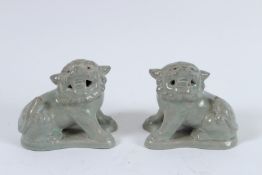 A PAIR OF RU WARE LIONS. 9cms high.