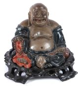A GOOD CHINESE LACQUER FIGURE OF BUDDHA, known as The Laughing Buddha, on a wooden base.