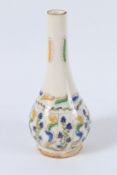 A TURKISH KUTAHYA POTTERY VASE with yellow and blue leaves. 23cms high.