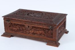A FINELY CARVED INDIAN SANDALWOOD BOX. 28cms long.