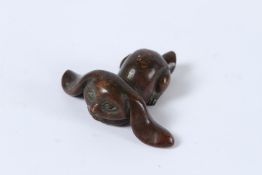 A JAPANESE BRONZE OKIMONO RABBIT. 5cms.